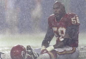4 Oct 1998:  Outside lineback Derrick Thomas #58 of the Kansas City Chiefs sits on the field in the rain during a game against the Seattle Seahawks at the Arrowhead Stadium in Kansas City, Missouri. The Chiefs defeated the Seahawks 17-6.