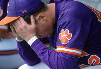 14 Jun 2000: Ryan Riley #42 of the Clemson Tigers hangs his head as he sits in the dugout during the College World Series againt the Louisiana Lafayette Ragin Cajuns at the Resenblatt Stadium in Omaha, Nebraska. The Raggin Cajuns defeated the Tigers 6-3.Mandatory Credit: Andy Lyons  /Allsport