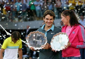 MADRID, SPAIN - MAY 17:  Mens and womens champions Dinara Safina of Russia and Roger Federer of Switzerland pose for photographs during the prize giving ceremony during the Madrid Open tennis tournament at the Caja Magica on May 17, 2009 in Madrid, Spain.  (Photo by Clive Brunskill/Getty Images)