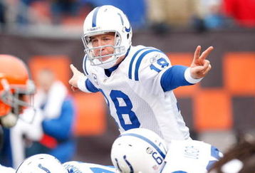 CLEVELAND - NOVEMBER 30:  Quarterback Peyton Manning #18 of the Indianapolis Colts signals a play at the line of scrimmage behind center during their NFL game against the Cleveland Browns on November 30, 2008 at Cleveland Browns Stadium in Cleveland, Ohio. The Colts defeated the Browns 10-6.  (Photo by Gregory Shamus/Getty Images)