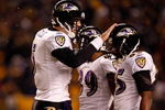 PITTSBURGH - JANUARY 18:  Joe Flacco #5 of the Baltimore Ravens talks on the field with Derrick Mason #85 and Mark Clayton #89 against the Pittsburgh Steelers during the AFC Championship game on January 18, 2009 at Heinz Field in Pittsburgh, Pennsylvania.  (Photo by Streeter Lecka/Getty Images)