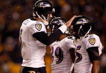 PITTSBURGH - JANUARY 18:  Joe Flacco #5 of the Baltimore Ravens talks on the field with Derrick Mason #85 and Mark Clayton #89 against the Pittsburgh Steelers during the AFC Championship game on January 18, 2009 at Heinz Field in Pittsburgh, Pennsylvania.  (Photo by Streeter Lecka/Getty Images)
