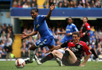 LONDON, ENGLAND - MAY 17:  Florent Malouda of Chelsea attempts to control the ball in front of Keith Andrews of Blackburn during the Barclays Premier League match between Chelsea and Blackburn Rovers at Stamford Bridge on May 17, 2009 in London, England.  (Photo by Bryn Lennon/Getty Images)