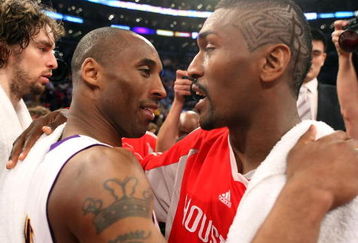 LOS ANGELES, CA - MAY 17:  Kobe Bryant #24 of the Los Angeles Lakers hugs Ron Artest #96 of the Houston Rockets after the Lakers defeated the Rockets 89-70 in Game Seven of the Western Conference Semifinals during the 2009 NBA Playoffs at Staples Center on May 17, 2009 in Los Angeles, California. NOTE TO USER: User expressly acknowledges and agrees that, by downloading and or using this photograph, User is consenting to the terms and conditions of the Getty Images License Agreement.  (Photo by Stephen Dunn/Getty Images)