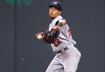 KANSAS CITY, MO - MAY 28:  Carlos Gomez #22 of the Minnesota Twins fields the ball against the Kansas City Royals on May 28, 2008 at Kauffman Stadium in Kansas City, Missouri. (Photo by G. Newman Lowrance/Getty Images)