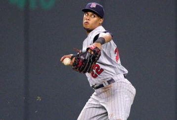 KANSAS CITY, MO - MAY 28:  Carlos Gomez #22 of the Minnesota Twins fields the ball against the Kansas City Royals on May 28, 2008 at Kauffman Stadium in Kansas City, Missouri. (Photo by G. Newman Lowrance/Getty Images)
