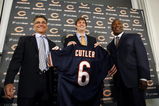 LAKE FOREST, IL - APRIL 3:  Chicago Bears general manager Jerry Angelo, quarterback Jay Cutler and head coach Lovie Smith are all smiles after introducing Cutler as their new quarterback during a press conference on April 3, 2009 at Halas Hall in Lake Forest, Illinois. (Photo by Jim Prisching/Getty Images)