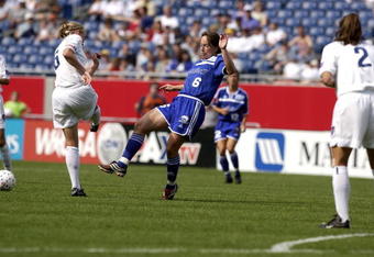 FOXBORO, MA - JUNE 1:  Maren Meinert of the Boston Breakers passes the ball past Lindsey Sloekar of the Washington Freedom during their WUSA match on June 1, 2002 at CMGI Field in Foxboro, Massachusetts.  (Photo By Robert E. Klein/Getty Images)