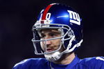 EAST RUTHERFORD, NJ - DECEMBER 21:  Quarterback Eli Manning #10 of the New York Giants stands on the field before their game against the Carolina Panthers on December 21, 2008 at Giants Stadium in East Rutherford, New Jersey.  (Photo by Chris McGrath/Getty Images)