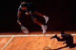 MADRID, SPAIN - MAY 17:  Roger Federer of Switzerland serves against Rafael Nadal of Spain during the Madrid Open Men's Final at the Caja Magica on May 17, 2009 in Madrid, Spain.  (Photo by Clive Brunskill/Getty Images)