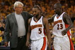 OAKLAND, CA - MAY 11:  Baron Davis #5 of the Golden State Warriors is congratulated by Head Coach Don Nelson and Jason Richardson #23 after defeating the Utah Jazz in Game Three of the Western Conference Semifinals during the 2007 NBA Playoffs at Oracle Arena May 11, 2007 in Oakland, California. The Warriors defeated the Jazz 125-105. NOTE TO USER: User expressly acknowledges and agrees that, by downloading and or using this photograph, user is consenting to the terms and conditions of the Getty Images License Agreement.  (Photo by Justin Sullivan/Getty Images)
