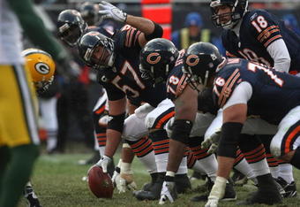 CHICAGO - DECEMBER 23: Olin Kruetz #57 of the Chicago Bears readies to make the snap against the Green Bay Packers on December 23, 2007 at Soldier Field in Chicago, Illinois. (Photo by Jonathan Daniel/Getty Images)