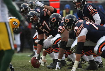 CHICAGO - DECEMBER 23: Olin Kruetz #57 of the Chicago Bears readies to make the snap against the Green Bay Packers on December 23, 2007 at Soldier Field in Chicago, Illinois. (Photo by Jonathan Daniel/Getty Images)