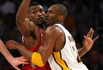LOS ANGELES, CA - MAY 17:  Kobe Bryant #24 of the Los Angeles Lakers is covered by Ron Artest #96 of the Houston Rockets in the third quarter of Game Seven of the Western Conference Semifinals during the 2009 NBA Playoffs at Staples Center on May 17, 2009 in Los Angeles, California. NOTE TO USER: User expressly acknowledges and agrees that, by downloading and or using this photograph, User is consenting to the terms and conditions of the Getty Images License Agreement.  (Photo by Stephen Dunn/Getty Images)