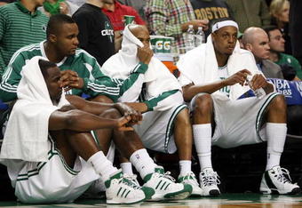 BOSTON - MAY 17:  Kendrick Perkins #43, Glen Davis #11, Stephon Marbury #8 and Paul Pierce #34 of the Boston Celtics watch from the bench as the Orlando Magic win Game Seven of the Eastern Conference Semifinals during the 2009 NBA Playoffs at TD Banknorth Garden on May 17, 2009 in Boston, Massachusetts. The Orlando Magic defeated the Boston Celtics 101-82 to advance to the Eastern Conference Finals. NOTE TO USER: User expressly acknowledges and agrees that, by downloading and or using this photograph, User is consenting to the terms and conditions of the Getty Images License Agreement.  (Photo by Elsa/Getty Images)