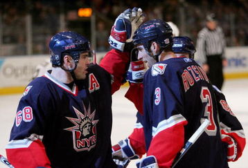 NEW YORK - JANUARY 28:  Michal Rozsival #3 is congratulated by teammate Jaromir Jagr #68 of the New York Rangers after Rozsival scored a goal to put the Rangers up 3-1 in the second period against the Pittsburgh Penguins on January 28, 2006 at Madison Square Garden in New York City.  (Photo by Ezra Shaw/Getty Images)