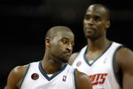 CHARLOTTE, NC - MARCH 13:  Raymond Felton #20 and teammate Emeka Okafor #50 of the Charlotte Bobcats react during their game against the Houston Rockets at Time Warner Cable Arena on March 13, 2009 in Charlotte, North Carolina. NOTE TO USER: User expressly acknowledges and agrees that, by downloading and/or using this Photograph, user is consenting to the terms and conditions of the Getty Images License Agreement.  (Photo by Streeter Lecka/Getty Images)