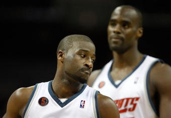 CHARLOTTE, NC - MARCH 13:  Raymond Felton #20 and teammate Emeka Okafor #50 of the Charlotte Bobcats react during their game against the Houston Rockets at Time Warner Cable Arena on March 13, 2009 in Charlotte, North Carolina. NOTE TO USER: User expressly acknowledges and agrees that, by downloading and/or using this Photograph, user is consenting to the terms and conditions of the Getty Images License Agreement.  (Photo by Streeter Lecka/Getty Images)