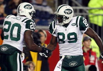FOXBORO, MA - NOVEMBER 13:  Jerricho Cotchery #89 of the New York Jets celebrates his touchdown with teammate Thomas Jones #20 in the second quarter against the New England Patriots on November 13, 2008 at Gillette Stadium in Foxboro, Massachusetts.  (Photo by Elsa/Getty Images)