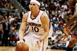 ATLANTA - APRIL 22:  Mike Bibby #10 of the Atlanta Hawks drives around James Jones #22 of the Miami Heat during Game Two of the Eastern Conference Quarterfinals at Philips Arena on April 22, 2009 in Atlanta, Georgia. The Heat defeated the Hawks 108-93. NOTE TO USER: User expressly acknowledges and agrees that, by downloading and/or using this Photograph, user is consenting to the terms and conditions of the Getty Images License Agreement.  (Photo by Doug Benc/Getty Images)
