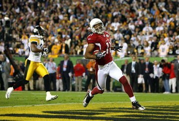 TAMPA, FL - FEBRUARY 01:  Larry Fitzgerald #11 of the Arizona Cardinals celebrates after scoring on a 64-yard touchdown reception in the fourth quarter against the Pittsburgh Steelers during Super Bowl XLIII on February 1, 2009 at Raymond James Stadium in Tampa, Florida. Steelers won 27-23. (Photo by Al Bello/Getty Images)
