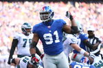 EAST RUTHERFORD, NJ - JANUARY 11:  Justin Tuck #91 of the New York Giants looks on after a defensive play during the NFC Divisional Playoff Game against the Philadelphia Eagles on January 11, 2009 at Giants Stadium in East Rutherford, New Jersey.  The Eagles defeated the Giants 23-11. (Photo by Al Bello/Getty Images)