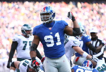 EAST RUTHERFORD, NJ - JANUARY 11:  Justin Tuck #91 of the New York Giants looks on after a defensive play during the NFC Divisional Playoff Game against the Philadelphia Eagles on January 11, 2009 at Giants Stadium in East Rutherford, New Jersey.  The Eagles defeated the Giants 23-11. (Photo by Al Bello/Getty Images)