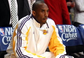 LOS ANGELES, CA - MAY 17:  Kobe Bryant #24 of the Los Angeles Lakers looks on from the bench before taking on the Houston Rockets in Game Seven of the Western Conference Semifinals during the 2009 NBA Playoffs at Staples Center on May 17, 2009 in Los Angeles, California. NOTE TO USER: User expressly acknowledges and agrees that, by downloading and or using this photograph, User is consenting to the terms and conditions of the Getty Images License Agreement.  (Photo by Stephen Dunn/Getty Images)