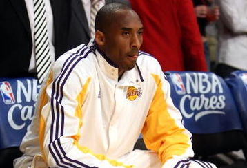 LOS ANGELES, CA - MAY 17:  Kobe Bryant #24 of the Los Angeles Lakers looks on from the bench before taking on the Houston Rockets in Game Seven of the Western Conference Semifinals during the 2009 NBA Playoffs at Staples Center on May 17, 2009 in Los Angeles, California. NOTE TO USER: User expressly acknowledges and agrees that, by downloading and or using this photograph, User is consenting to the terms and conditions of the Getty Images License Agreement.  (Photo by Stephen Dunn/Getty Images)