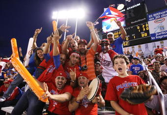 SAN JUAN, PUERTO RICO - MARCH 11:  Fans of Puerto Rico cheer against The Netherlands during the 2009 World Baseball Classic Pool D match on March 11, 2009 at Hiram Bithorn Stadium in San Juan, Puerto Rico.  (Photo by Al Bello/Getty Images)