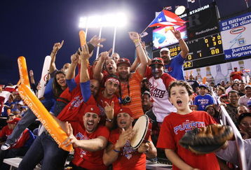 SAN JUAN, PUERTO RICO - MARCH 11:  Fans of Puerto Rico cheer against The Netherlands during the 2009 World Baseball Classic Pool D match on March 11, 2009 at Hiram Bithorn Stadium in San Juan, Puerto Rico.  (Photo by Al Bello/Getty Images)
