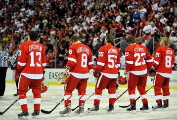 DETROIT - MAY 17:  (L-R) Pavel Datsyuk #13, Justin Abdelkader #8, Niklas Kronwall #55, Brad Stuart #23 and Marian Hossa #81 of the Detroit Red Wings stand for the performing of the National Anthem against the Chicago Blackhawks during Game One of the Western Conference Championship Round of the 2009 Stanley Cup Playoffs on May 17, 2009 at Joe Louis Arena in Detroit, Michigan.  (Photo by Jamie Sabau/Getty Images)