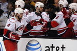 BOSTON - MAY 14:  Dennis Seidenberg #4 of the Carolina Hurricanes celebrates with teammates on the bench in the first period against the Boston Bruins during Game Seven of the Eastern Conference Semifinal Round of the 2009 Stanley Cup Playoffs on May 14, 2009 at the TD Banknorth Garden in Boston, Massachusetts. The Hurricanes defeated the Bruins 3-2 in overtime.  (Photo by Elsa/Getty Images)