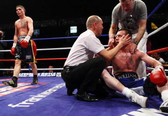 BELFAST, NORTHERN IRELAND - MAY 15:  Michael Jennings (L) stops his opponent in his Welterweight fight against Willie Thompson at The Odyssey Arena on May 15, 2009 in Belfast, Northern Ireland.  (Photo by John Gichigi/Getty Images)