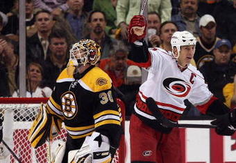 BOSTON - MAY 14:  Rod Brind'Amour #17 of the Carolina Hurricanes celebrates his goal as Tim Thomas #30 of the Boston Bruins looks on during Game Seven of the Eastern Conference Semifinal Round of the 2009 Stanley Cup Playoffs on May 14, 2009 at the TD Banknorth Garden in Boston, Massachusetts. The Hurricanes defeated the Bruins 3-2 in overtime.  (Photo by Elsa/Getty Images)