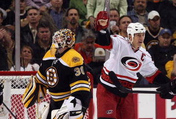 BOSTON - MAY 14:  Rod Brind'Amour #17 of the Carolina Hurricanes celebrates his goal as Tim Thomas #30 of the Boston Bruins looks on during Game Seven of the Eastern Conference Semifinal Round of the 2009 Stanley Cup Playoffs on May 14, 2009 at the TD Banknorth Garden in Boston, Massachusetts. The Hurricanes defeated the Bruins 3-2 in overtime.  (Photo by Elsa/Getty Images)