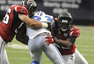 ATLANTA, GA - SEPTEMBER 7: Linebacker Keith Brooking #56 (left)  of the Atlanta Falcons tackles a Detroit Lions runner at the Georgia Dome on September 7, 2008 in Atlanta, Georgia.  (Photo by Al Messerschmidt/Getty Images) 
