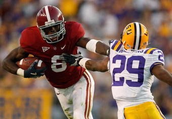BATON ROUGE, LA - NOVEMBER 08:  Julio Jones #8 of the Alabama Crimson Tide avoids a tackle by Chris Hawkins #29 of the Louisiana State University Tigers  on November 11, 2008 at Tiger Stadium in Baton Rouge, Louisiana. The Tide defeated the Tigers 27-21 in overtime.  (Photo by Chris Graythen/Getty Images)