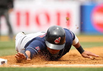 NEW YORK - APRIL 19:  Shin-soo Choo #17 of the Cleveland Indians slides back to first base during their game against the New York Yankees at Yankee Stadium on April 19, 2009 in the Bronx borough of New York City.  (Photo by Ezra Shaw/Getty Images)