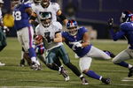 EAST RUTHERFORD, NJ - DECEMBER 17:  Quarterback Jeff Garcia #7 of the Philadelphia Eagles scrambles against Osi Umenyiora #72 of the New York Giants on December 17, 2006 at Giants Stadium in East Rutherford, New Jersey. The Eagles defeated the Giants 36-22. (Photo by Jim McIsaac/Getty Images)