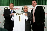 OAKLAND, CA - APRIL 1:  Lewis Wolff (C), new co-owner and managing partner of the Oakland Athletics, holds a jersey during a photo-op with Athletics Vice President and General Manager Billy Beane (R) and President Michael Crowley at a news conference on April 1, 2005 in Oakland, California. Major League Baseball approved the sale of the Athletics on March 30th to a group headed by Wolff which includes his son, Keith Wolff, and billionaire John Fisher, son of Gap founder Donald Fisher.  (Photo by Justin Sullivan/Getty Images)