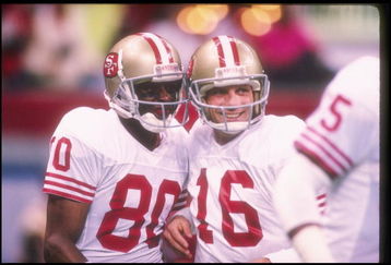 28 Jan 1990:  San Francisco 49ers quarterback Joe Montana (right) and wide receiver Jerry Rice celebrate during Super Bowl XXIV against the Denver Broncos at the Superdome in New Orleans, Louisiana.  The 49ers won the game, 55-10. Mandatory Credit: Rick S