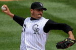 DENVER - APRIL 26:  Starting pitcher Jason Marquis #21 of the Colorado Rockies delivers against the Los Angeles Dodgers at Coors Field on April 26, 2009 in Denver, Colorado. Marquis earned the win as the Rockies defeated the Dodgers 10-4.  (Photo by Doug Pensinger/Getty Images)