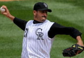 DENVER - APRIL 26:  Starting pitcher Jason Marquis #21 of the Colorado Rockies delivers against the Los Angeles Dodgers at Coors Field on April 26, 2009 in Denver, Colorado. Marquis earned the win as the Rockies defeated the Dodgers 10-4.  (Photo by Doug Pensinger/Getty Images)