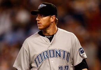 NEW YORK - JUNE 03:  Roy Halladay #32 of the Toronto Blue Jays walks to the dugout against the New York Yankees on June 3, 2008 at Yankee Stadium in the Bronx borough of New York City.  (Photo by Nick Laham/Getty Images)