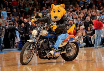 DENVER - MARCH 05:  Rocky the Nuggets mascot rides a Harley Davidson motorcycle aroundt he court as the Portland Trail Blazers face the Denver Nuggets during NBA action at the Pepsi Center on March 5, 2009 in Denver, Colorado. The Nuggets defeated the Trail Blazers 106-90. NOTE TO USER: User expressly acknowledges and agrees that, by downloading and/or using this Photograph, user is consenting to the terms and conditions of the Getty Images License Agreement.  (Photo by Doug Pensinger/Getty Images)