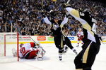 PITTSBURGH - MAY 18:  Evgeni Malkin #71 of the Pittsburgh Penguins reacts toward Philippe Boucher #43 after Boucher's go-ahead goal against goaltender Cam Ward #30 of the Carolina Hurricanes during Game One of the Eastern Conference Championship Round of the 2009 Stanley Cup Playoffs on May 18, 2009 at Mellon Arena in Pittsburgh, Pennsylvania.  (Photo by Jamie Sabau/Getty Images)