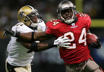 NEW ORLEANS - OCTOBER 8:  Running back Cadillac Williams #24 of the Tampa Bay Buccaneers runs the ball against Roman Harper #41 of the New Orleans Saints at the Louisiana Superdome on October 8, 2006 in New Orleans, Louisiana.  (Photo by Ronald Martinez/Getty Images)