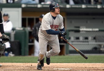 CHICAGO - APRIL 07:  Jason Kubel #16 of the Minnesota Twins drops his bat to run against the Chicago White Sox during the Opening Day game on April 7, 2008 at U.S. Cellular Field in Chicago, Illinois. (Photo by Jonathan Daniel/Getty Images) 