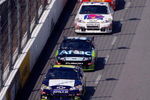 MARTINSVILLE, VA - MARCH 29: Scott Speed, driver of the #82 Red Bull Toyota, races along side Dale Earnhardt Jr., driver of the #88 National Guard/AMP Energy Chevrolet, during the NASCAR Sprint Cup Series Goody's Fast Pain Relief 500 at the Martinsville Speedway on March 29, 2009 in Martinsville, Virginia.  (Photo by John Harrelson/Getty Images)
